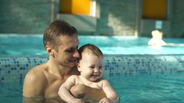 Father and baby in the pool — Stock Video