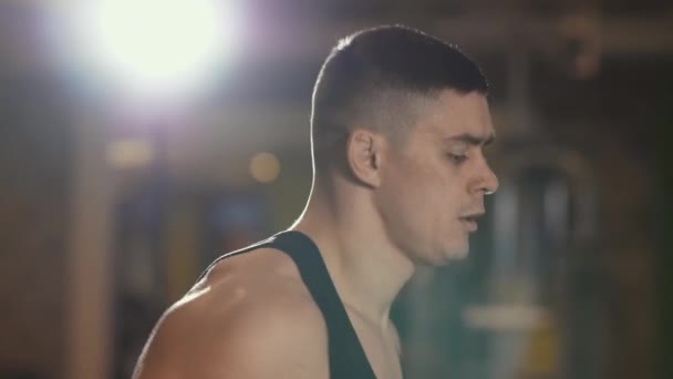 Young man running on a treadmill — Stock Video