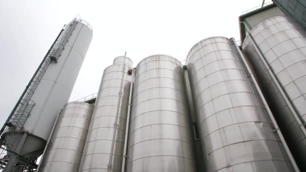 Large metal industrial tanks for liquid — Stockvideo