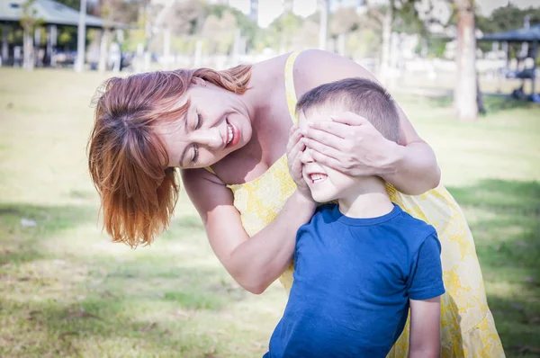 Young Caucasian Woman Closing Her Son Eyes Standing Him Trying — Stock Photo, Image