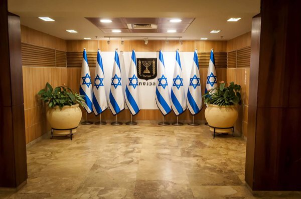 JERUSALEM, ISRAEL. April 3, 2016. Flags of Israel and coat of arms in the guest entrance of the Israeli Parliament (Knesset). Knesset concept image, parliamentary elections illustration