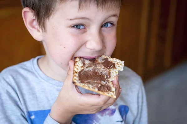 Closeup Portrait Cute Blue Eyed Child Eating Matzoh Cracker Chocolate — Stock Photo, Image