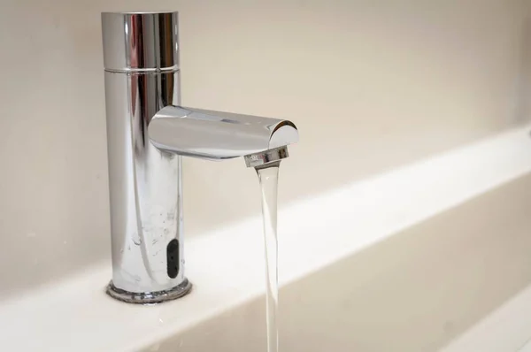 Steel Modern Design Steel Faucet Running Water Flow Wasting Water — Stock Photo, Image