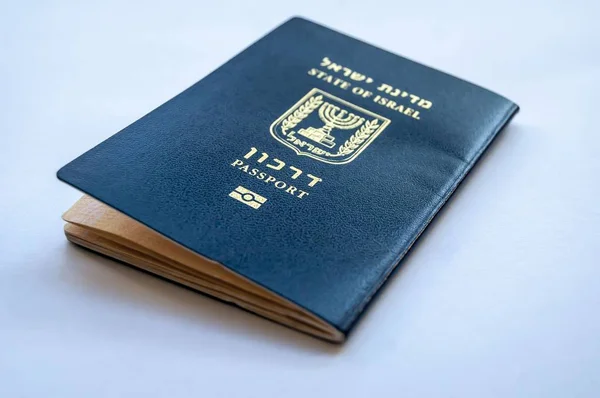 A blue passport of the State of Israel on a light blue background. Israel citizenship concept, Israeli bio-metric \