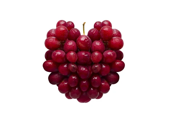 新鲜的红葡萄在白色背景查出的心脏形式 — 图库照片