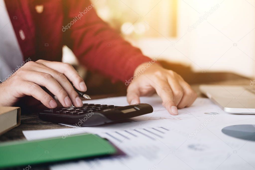 Close up view of bookkeeper or financial inspector hands making report, calculating or checking balance. Home finances, investment, economy, saving money or insurance concept