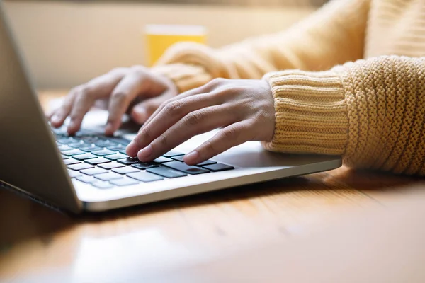 Young woman working or study from home. Close up hand with laptop — Stock Photo, Image