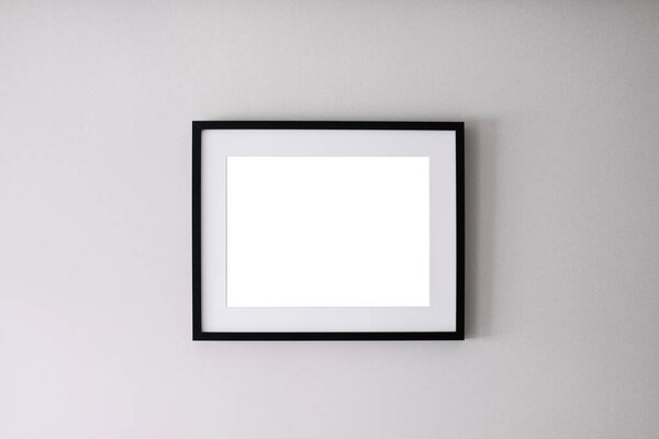 Blank frame on a white wall background.