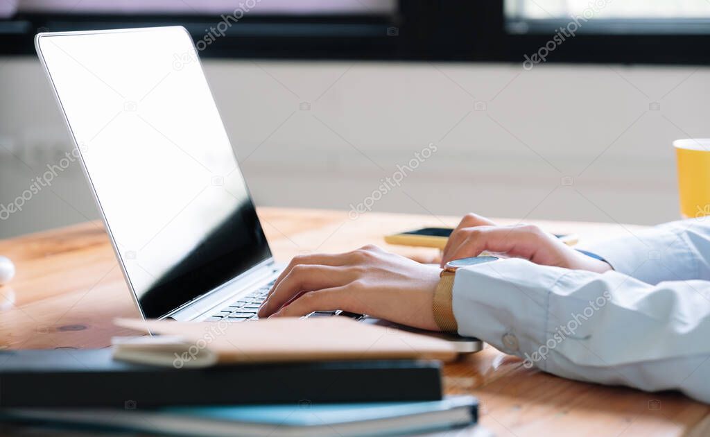 Close up of woman using laptop computer at home