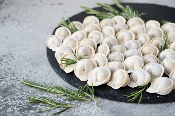 The crude frozen meat pelmeni for preparation