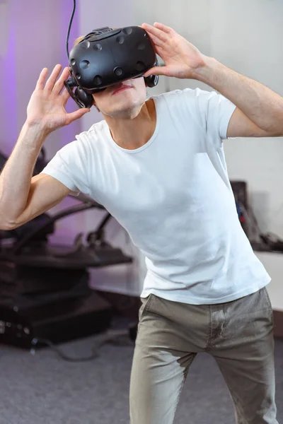 Young Handsome Guy Dresses Virtual Reality Glasses Royalty Free Stock Photos