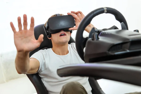 Young Handsome Guy White Shirt Playing Race Simulator Virtual Reality Royalty Free Stock Photos
