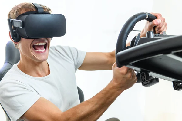 Young Handsome Guy White Shirt Playing Race Simulator Virtual Reality Royalty Free Stock Images