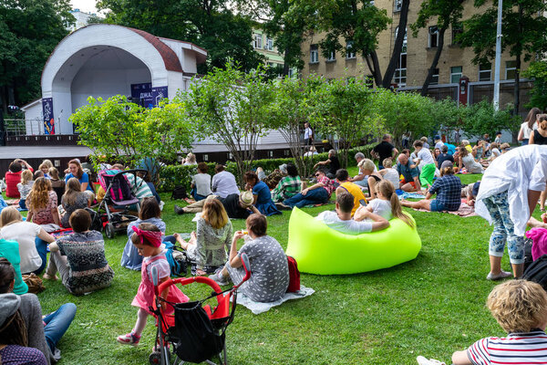 People having rest on the grass