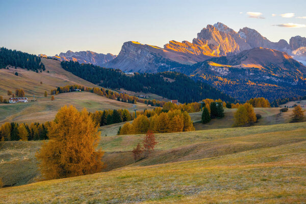Amazing autumn scenery of Alpe di Siusi - Seiser Alm - at sunrise, Dolomite Alps, Italy