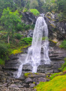 Scenic view of Steinsdalsfossen waterfall, Western Norway. Travel destination scene clipart