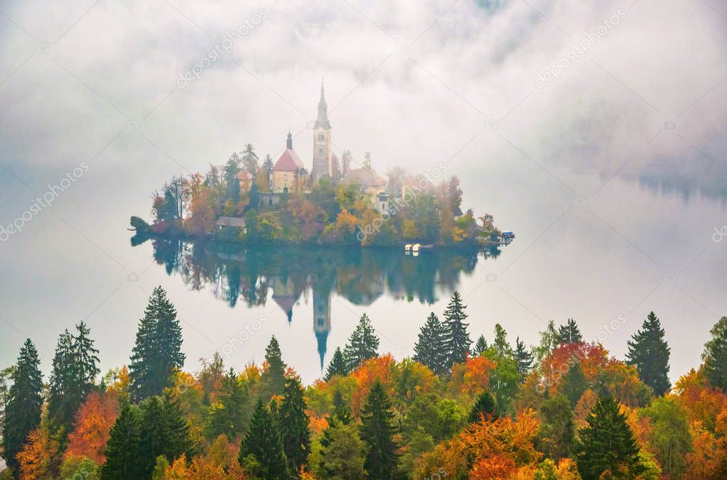 Amazing view of Lake Bled at foggy autumn morning