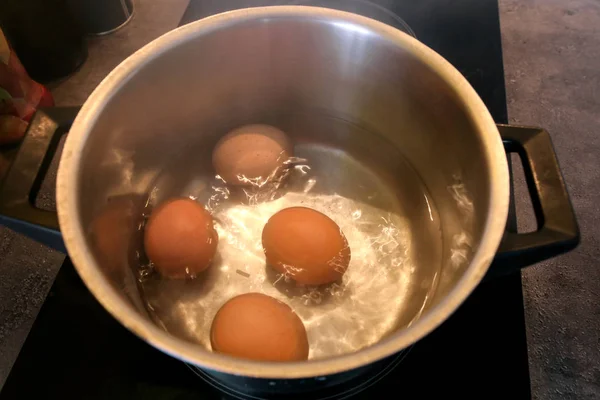 Top View Boiling Organic Eggs Metal Pot Saucepan Electric Stove — Stock Photo, Image