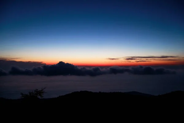 Sea, sky, sunset on horizon of mediterranean coast. Amazing sunset vibes on edge ocean. Sunrise over sea. Beautiful view, landscape and natural environment. Summer season, travel, vacation, holiday. — Stock Photo, Image