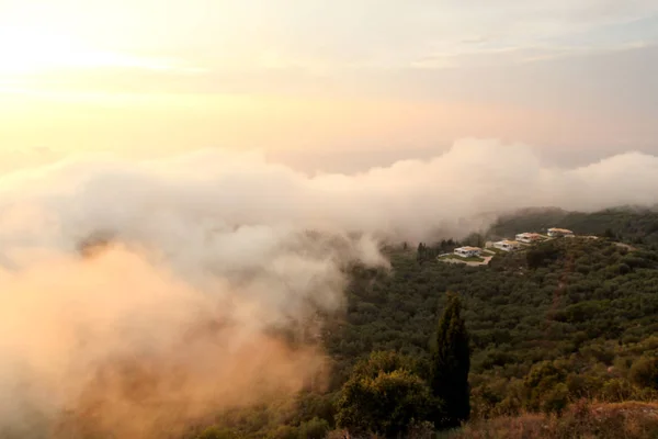 Beautiful structure of clouds on sky, mountain landscape with dense fog at sunset on horizon of beauty natural environment. Panorama of amazing sunrise view show sun rays through clouds over mountain.