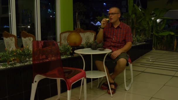 Man Sits Table Lobby Hotel Drinks Coffee Biscuits — Stock Video