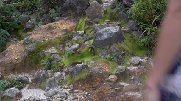 A woman walks along a stony path — Stock Video