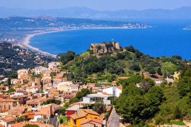 Begur, Old Town and Castle overlooking Mediterranean Sea and the Pyrenees mountains. Begur is a popular resort on Costa Brava, Catalonia, Spain. clipart
