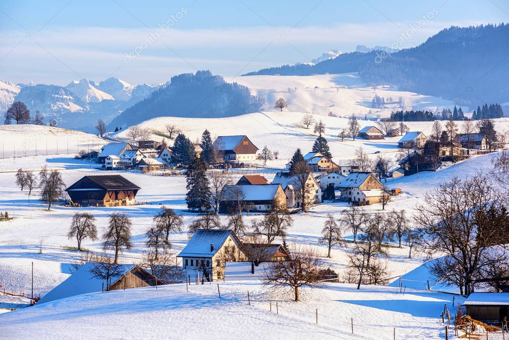 A snow covered village in swiss Alps, Switzerland, in winter tim