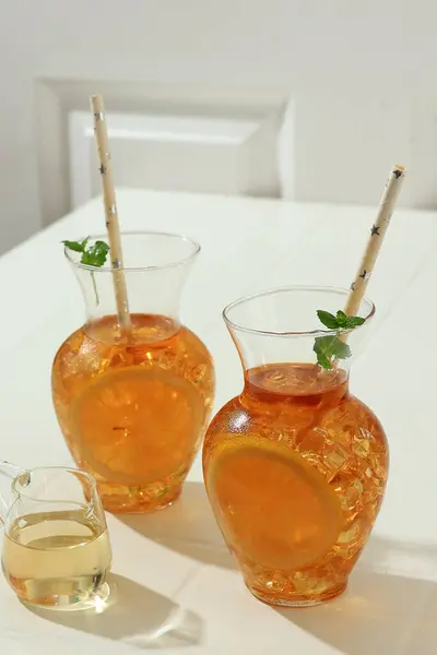 Sweet Ice Lemon  Tea Es Teh Manis with Liquid Sugar, Topping with Mint Leaf. Served on Carave