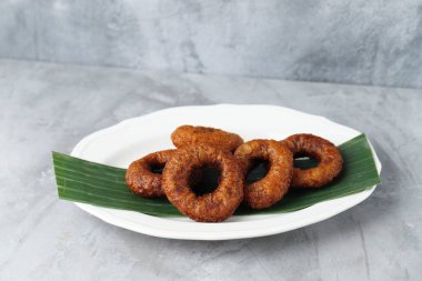 Ali Agrem Kue Ali, Indonesian Mini Donut Served with Tea. Ring Cake Made from Rice Flour with Coconut Palm Sugar clipart