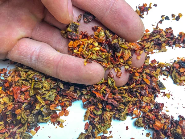 Different kinds of spices on white background. spices in hand.