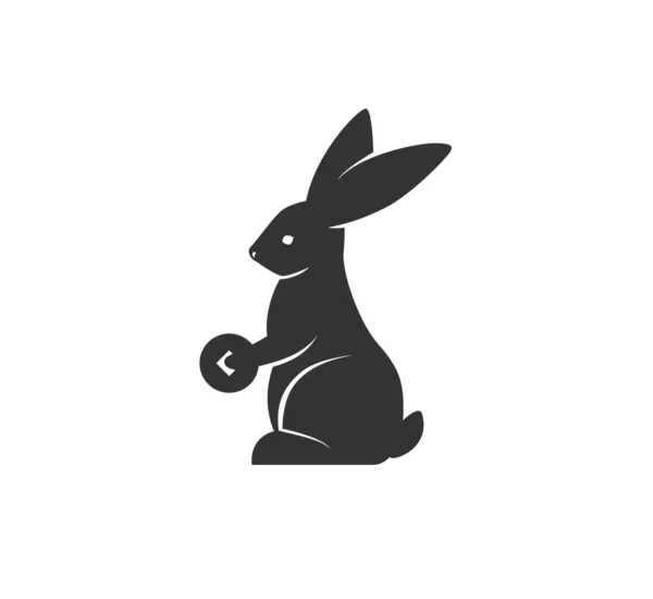 Rabbit silhouette holding coin vector illustration. Black and white bunny logo. Isolated on white background — Stock Vector