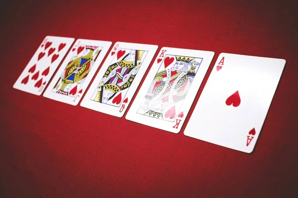 Poker Hands Royal Flush 3. Five playing cards - the poker royal flush hand. Royal Flash, card deck, poker royal flash on cards and poker chips on green casino table. success in gambling. soft focus