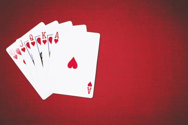 Poker Hands Royal Flush 3. Five playing cards - the poker royal flush hand. Royal Flash, card deck, poker royal flash on cards and poker chips on green casino table. success in gambling. soft focus