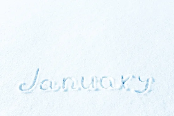 The inscription on the snow, the months of winter. January, the winter month.
