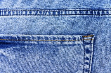 Denim arka plan, kot ceplerin yakın çekim. Soluk kot pantolon.
