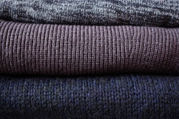 스웨터 배경의 뜨개질 패턴이 스택에 있습니다 따뜻한 아늑한 — 스톡 사진