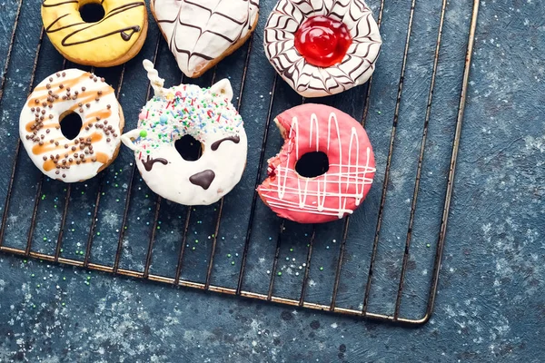 Frosted donuts on dark background — Stock Photo, Image