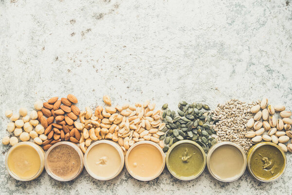 Nuts and seeds butter in glass jars