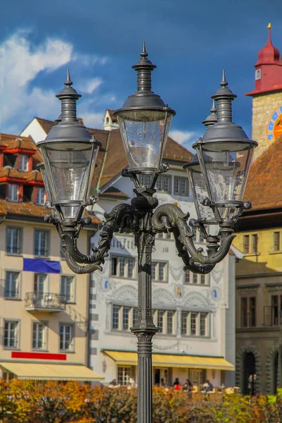 Old bronze street lamp on the street of the city of Lucerne (Switzerland)