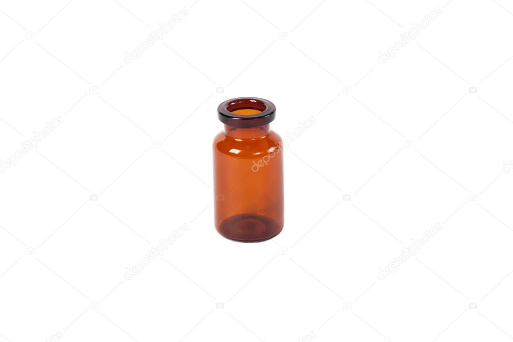 Brown glass vial on white isolated background