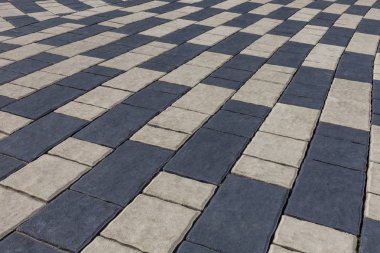 İki renk taş fayans ile döşeli bir yol şeklinde arka plan görüntüsü