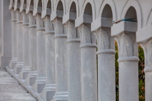 Standing unlikely stone pillars of an ancient staircase