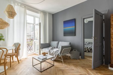 Scandi style, gray living room with balcony door clipart