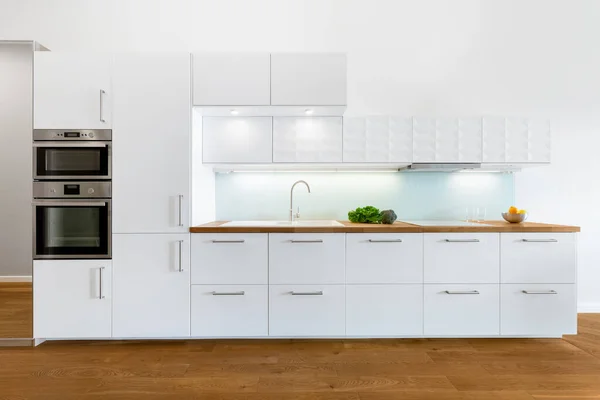 Modern Kitchen White Furniture Wooden Floor Countertop Build Oven Microwave — Stock Photo, Image