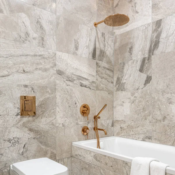 Fancy Bathroom Beige Marble Style Tiles White Bathtub Toilet Stylish — Stock Photo, Image