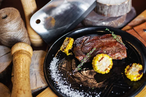 Grilled steak with corn and rosemary. Restaurant serving — Stock Photo, Image