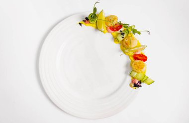 Fried scallop  on a white plate 