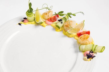 Fried scallop  on a white plate 