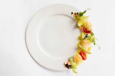 Fried scallop  on a white plate 